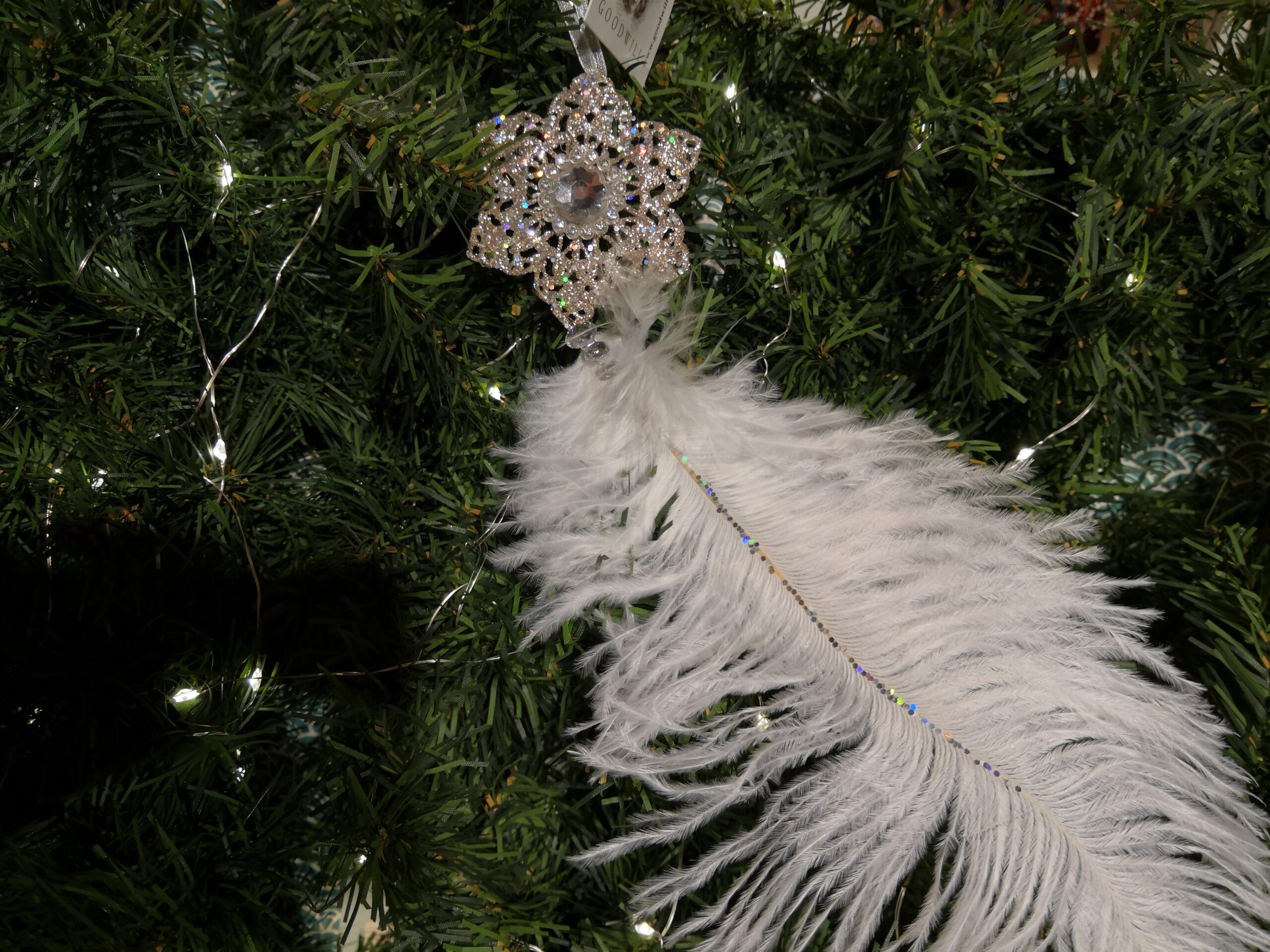 Snowflake decoration with white feather